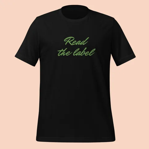 Black tee with "Read the label" hand-signed across the chest